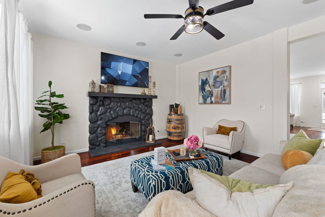 2561 Hennig Road Hampshire, IL 60140 - Photo 6 of 36 a living room with furniture and a fireplace
