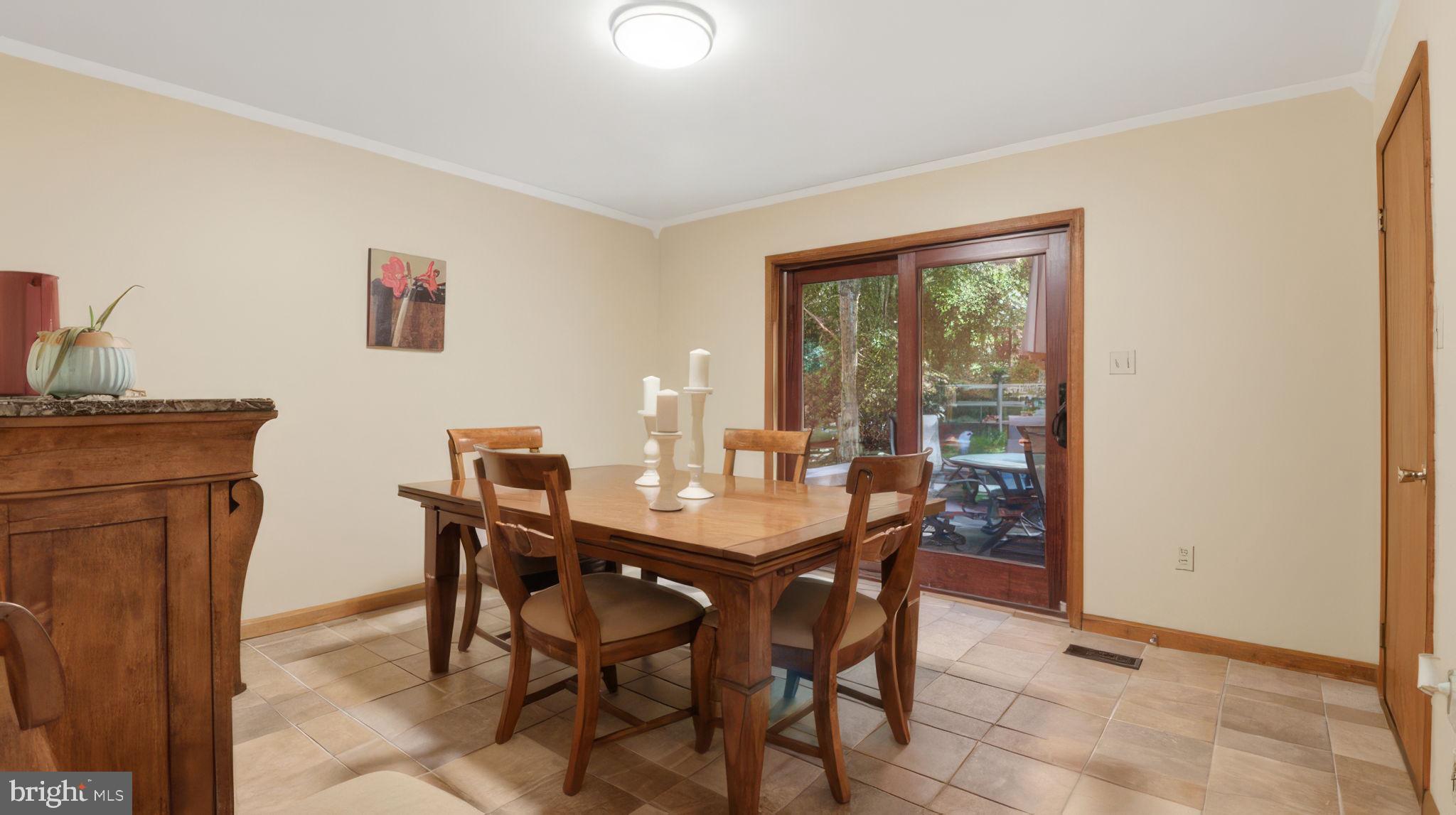 2185 Sams Creek Road Westminster, MD 21157 - Photo 13 of 56 Formal Dining Room walks out to deck