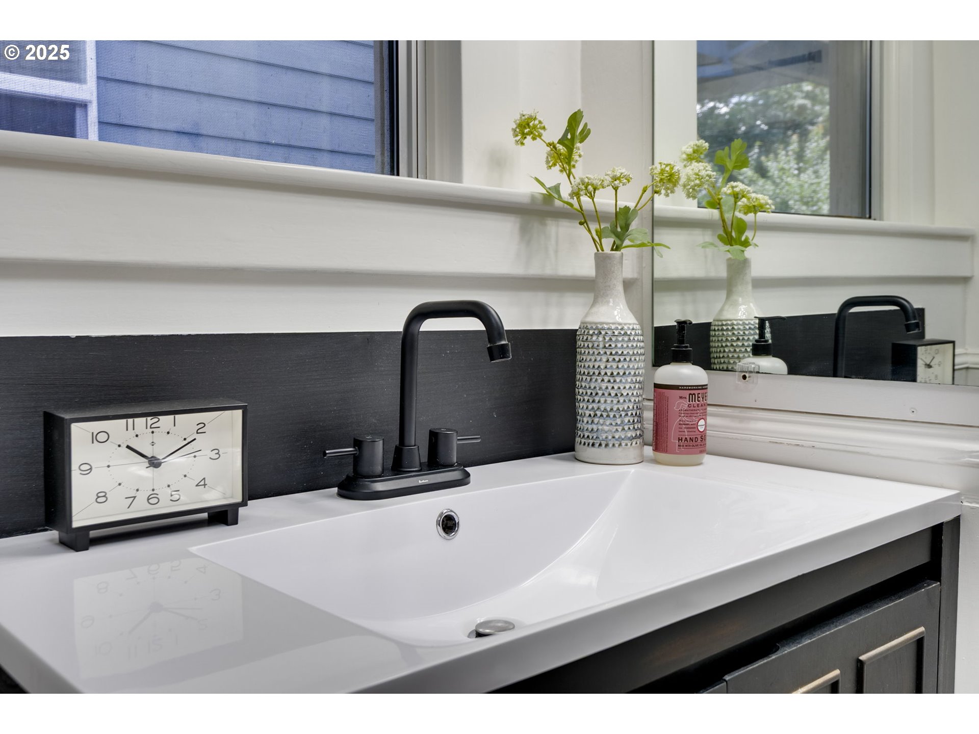 6020 Southeast 83rd Avenue Portland, OR 97266 - Photo 23 of 46 a bathroom with a sink and a mirror