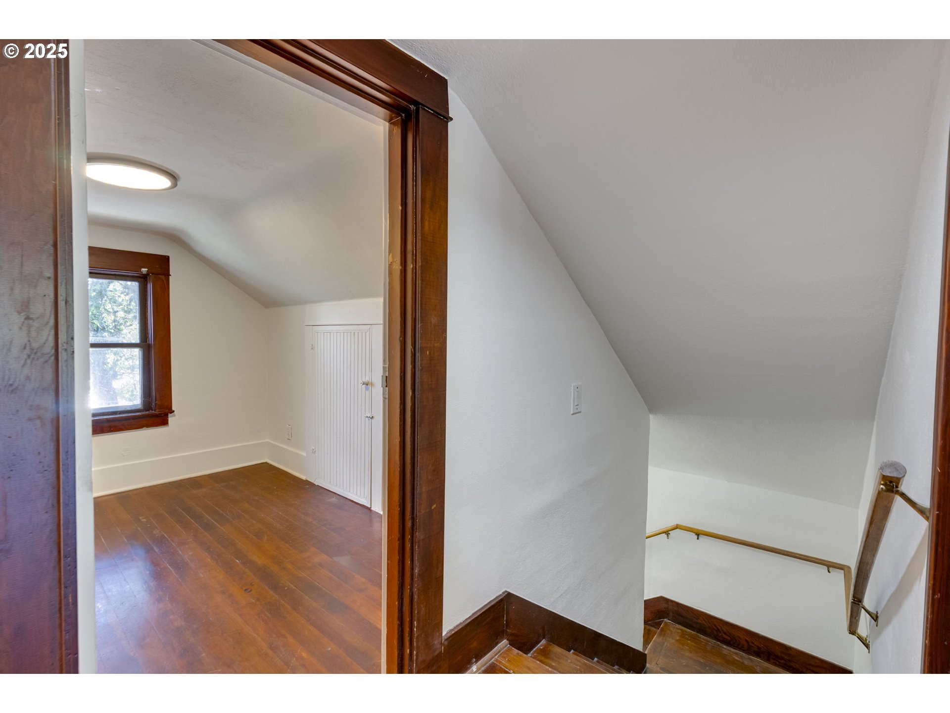 6020 Southeast 83rd Avenue Portland, OR 97266 - Photo 31 of 46 a view of an empty room with wooden floor and a window