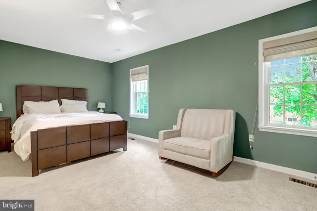 a bed room with a bed and a couch