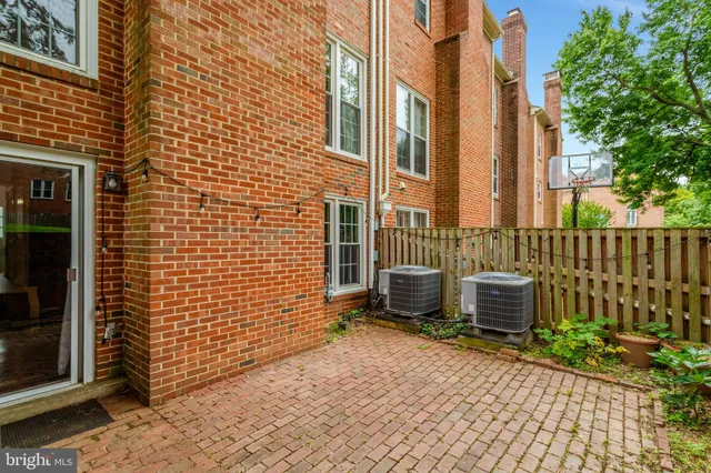 a view of a brick wall with a door