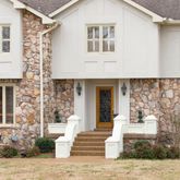 a front view of a house with a yard