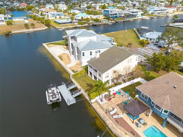 an aerial view of a house with outdoor space