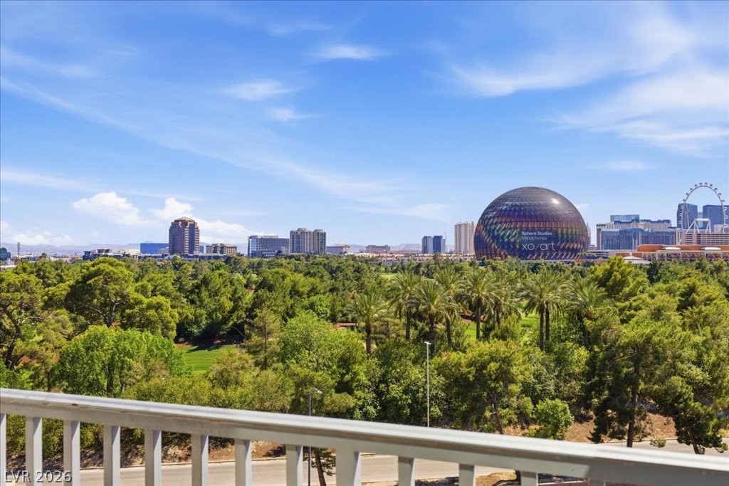 360 East Desert Inn Road, Unit 604 Las Vegas, NV 89109 - Photo 5 of 28 City skyline and verdant tree-lined expanse create a captivating outdoor view.