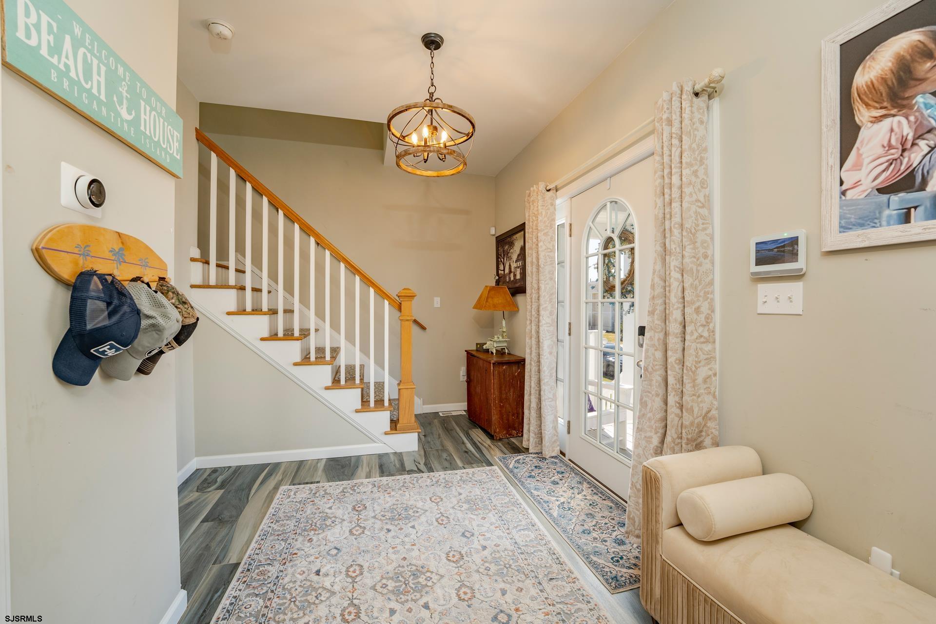 703 Bobby Jones Road Brigantine, NJ 08203 - Photo 9 of 34 a view of entryway and hall with wooden floor