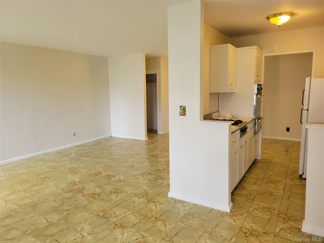 a view of a kitchen cabinets and wooden floor
