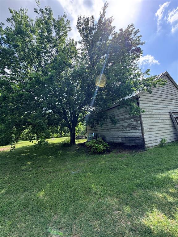 806 Old Base Road Aurora, TX 76078 - Photo 13 of 23 a backyard of a house with lots of green space