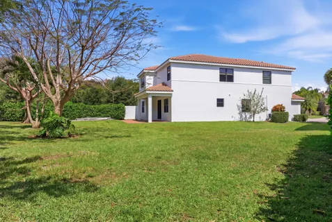 a front view of house with garden