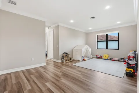 a view of a livingroom with furniture and a potted plant