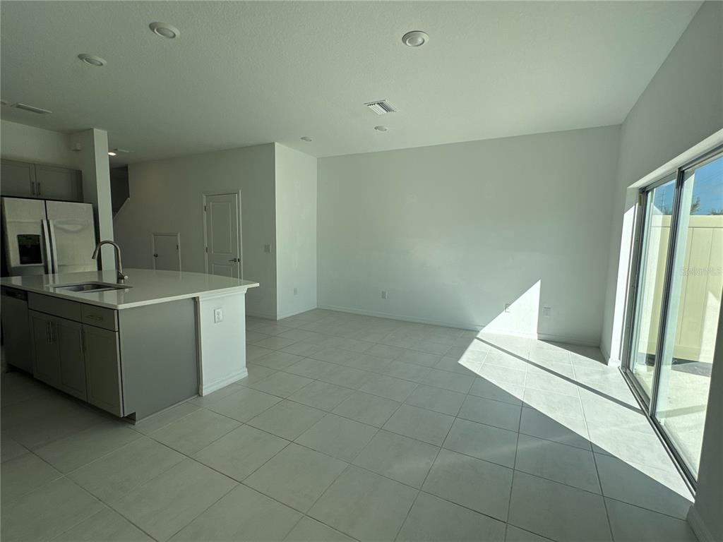 2416 Paravane Way Wesley Chapel, FL 33543 - Photo 11 of 35 a view of a kitchen with a sink