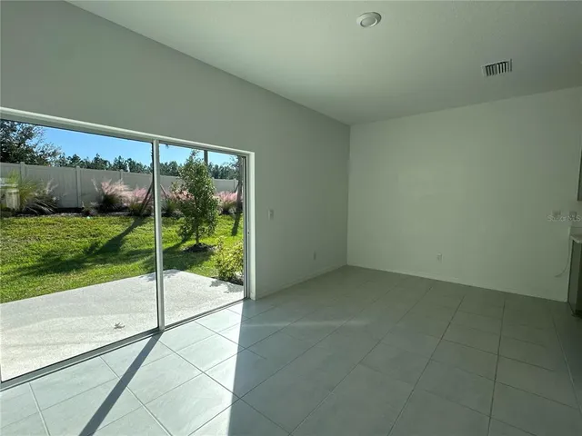 a view of a room with a floor to ceiling window and stairs