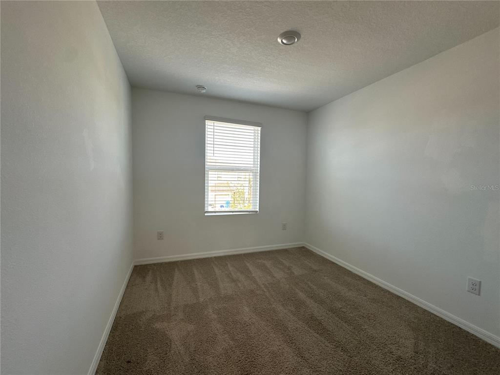 2416 Paravane Way Wesley Chapel, FL 33543 - Photo 17 of 35 an empty room with a window