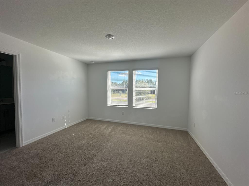2416 Paravane Way Wesley Chapel, FL 33543 - Photo 24 of 35 an empty room with a window