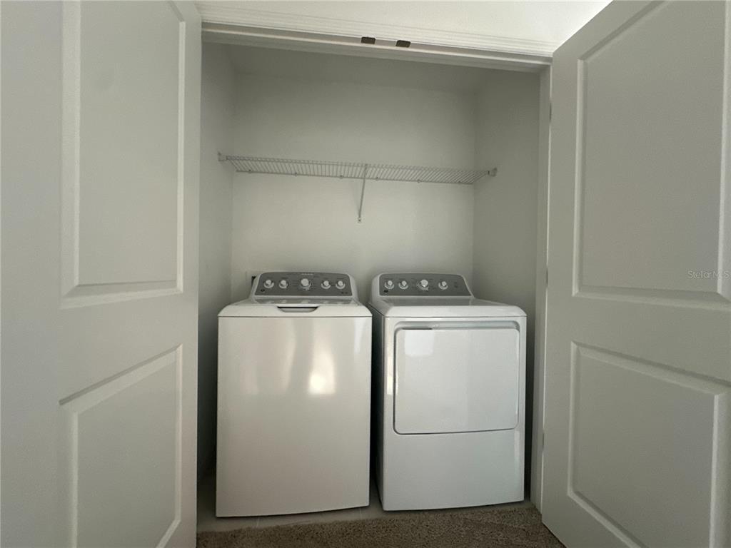 2416 Paravane Way Wesley Chapel, FL 33543 - Photo 33 of 35 a utility room with dryer and washer