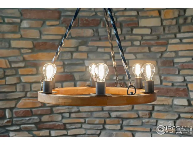 a view of a living room and a kitchen with furniture