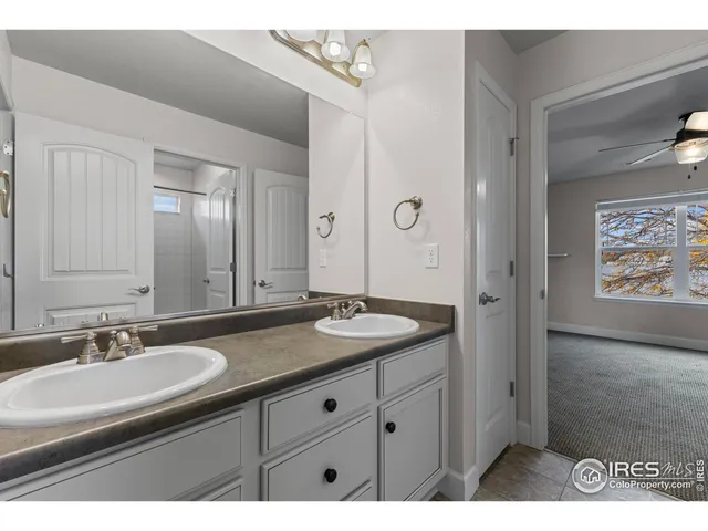 a view of an empty room with a ceiling fan