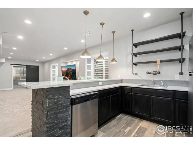 a living room with furniture a window and kitchen view