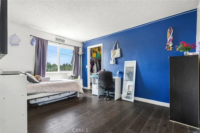 a bedroom with furniture and a window