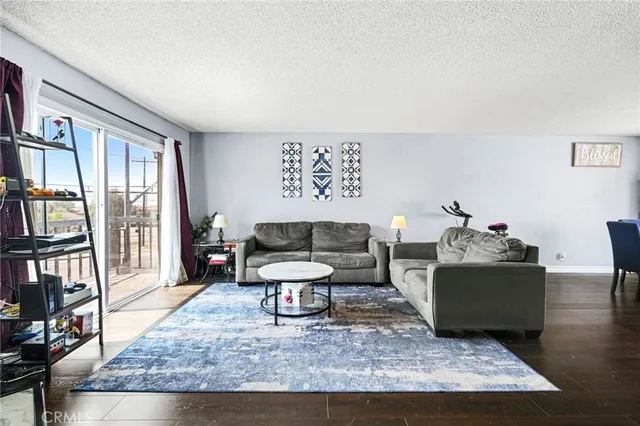 a living room with furniture and a rug