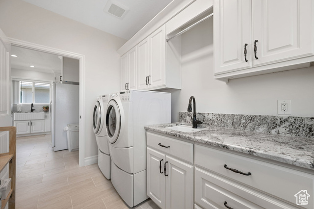 230 Boulder Way Leeds, UT 84746 - Photo 38 of 72 ADU full laundry room with sink, soft-close white cabinetry, recessed lighting and built-in ironing board