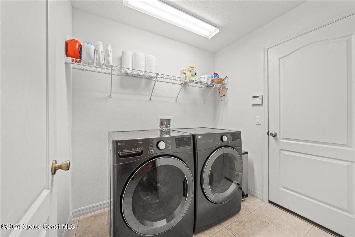 1952 Gloria Circle Palm Bay, FL 32905 - Photo 37 of 47 Indoor Laundry Room
