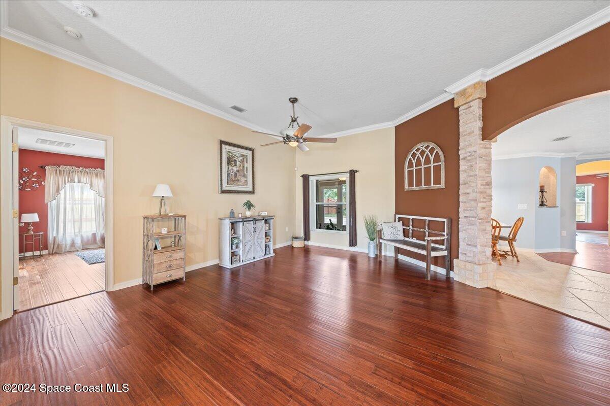 1952 Gloria Circle Palm Bay, FL 32905 - Photo 7 of 47 Living room with ceiling fan