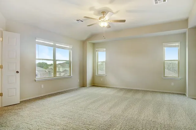 a view of an empty room with a window