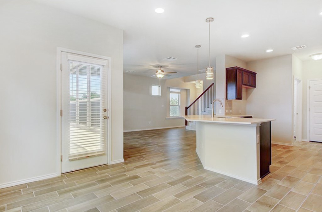3453 Pauling Loop Round Rock, TX 78665 - Photo 5 of 28 a view of kitchen and hall with wooden floor