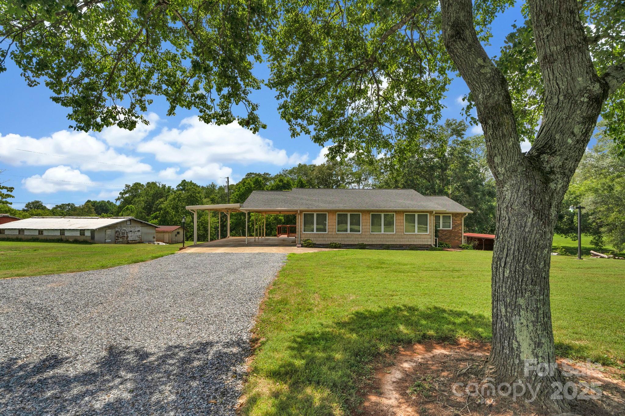 2036 Biggers Lake Road Shelby, NC 28152 - Photo 2 of 45 a view of a house with a yard
