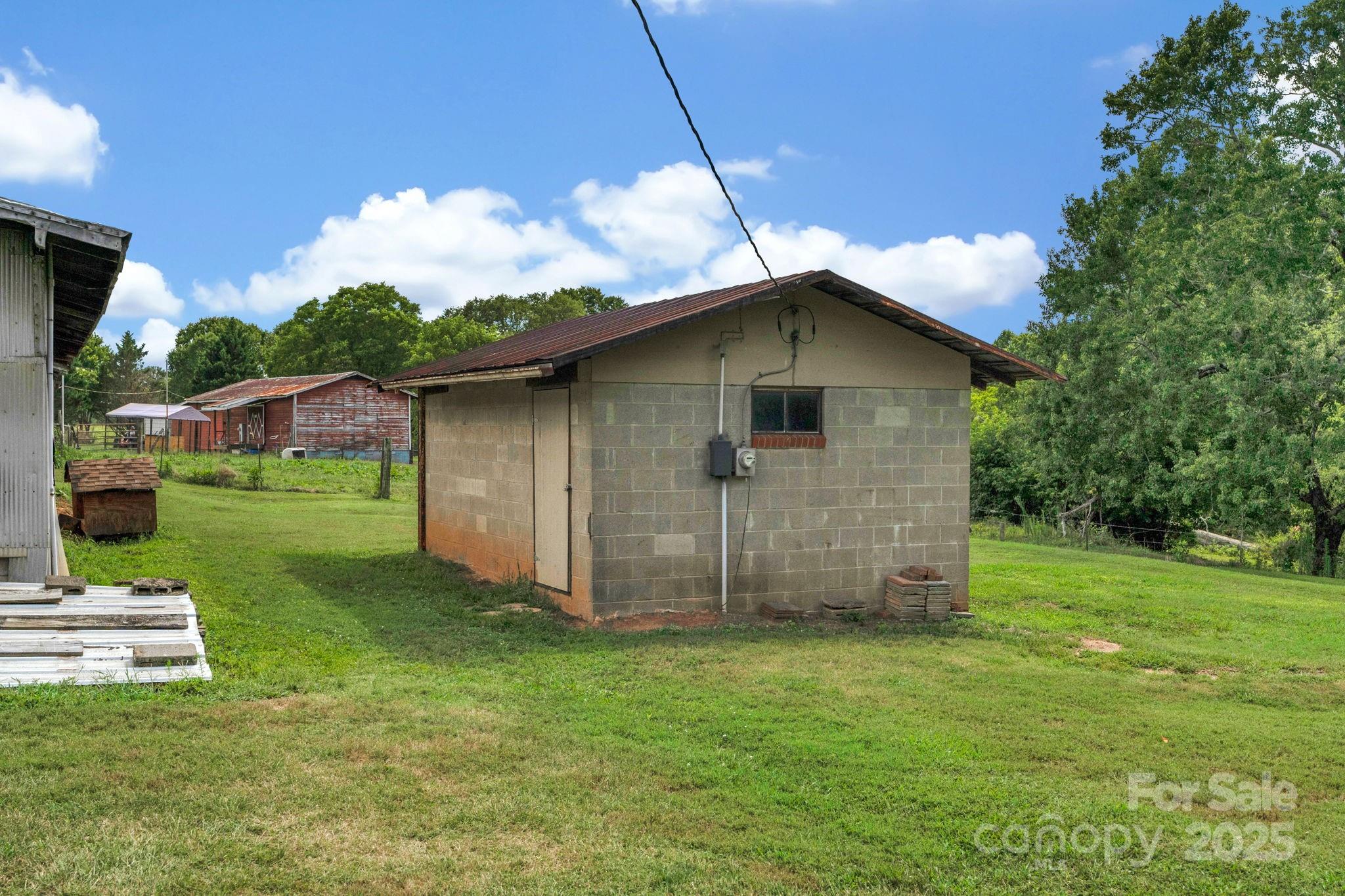 2036 Biggers Lake Road Shelby, NC 28152 - Photo 31 of 45 a backyard of a house with table and chairs