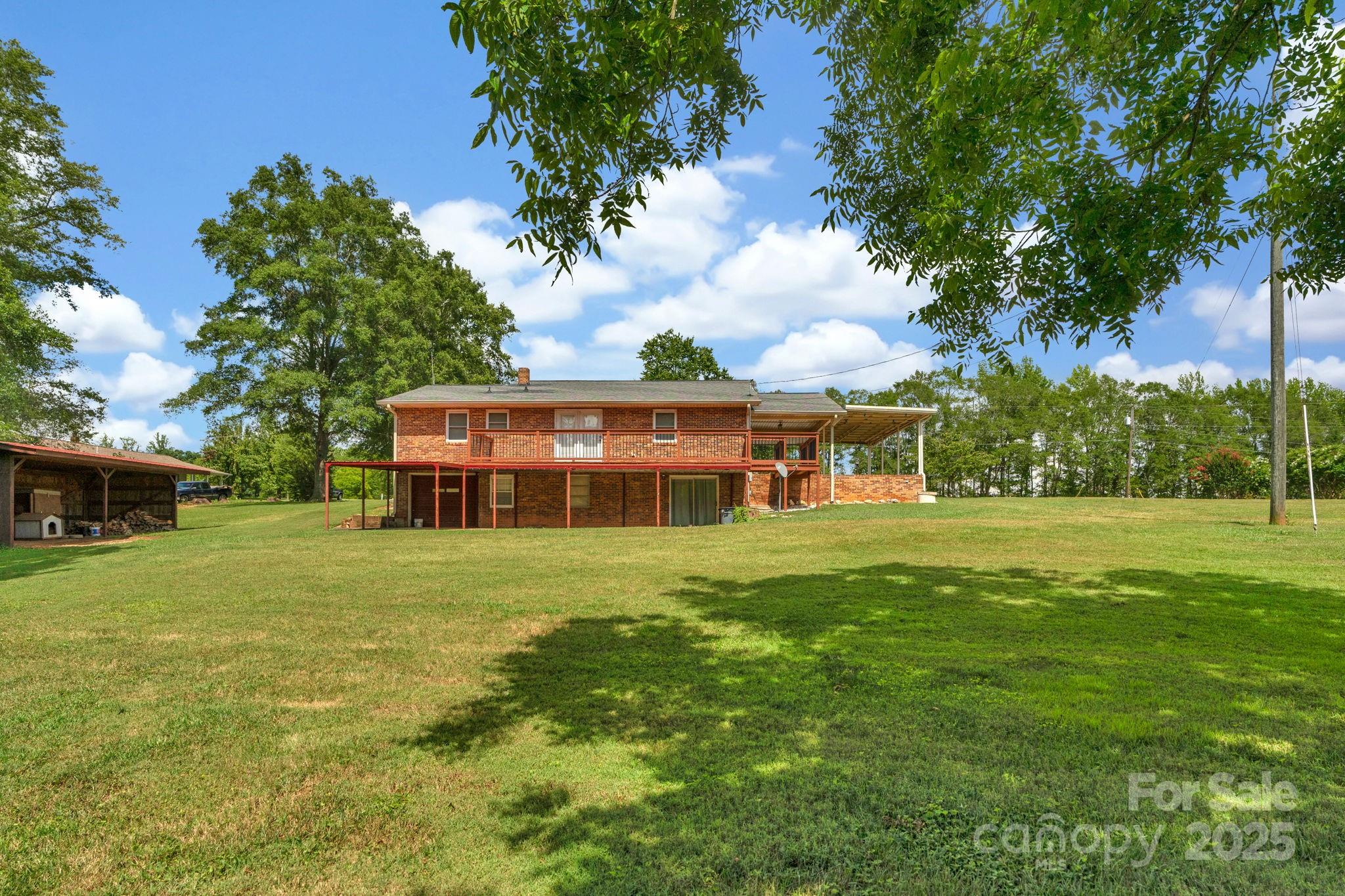 2036 Biggers Lake Road Shelby, NC 28152 - Photo 36 of 45 a front view of house with yard and trees
