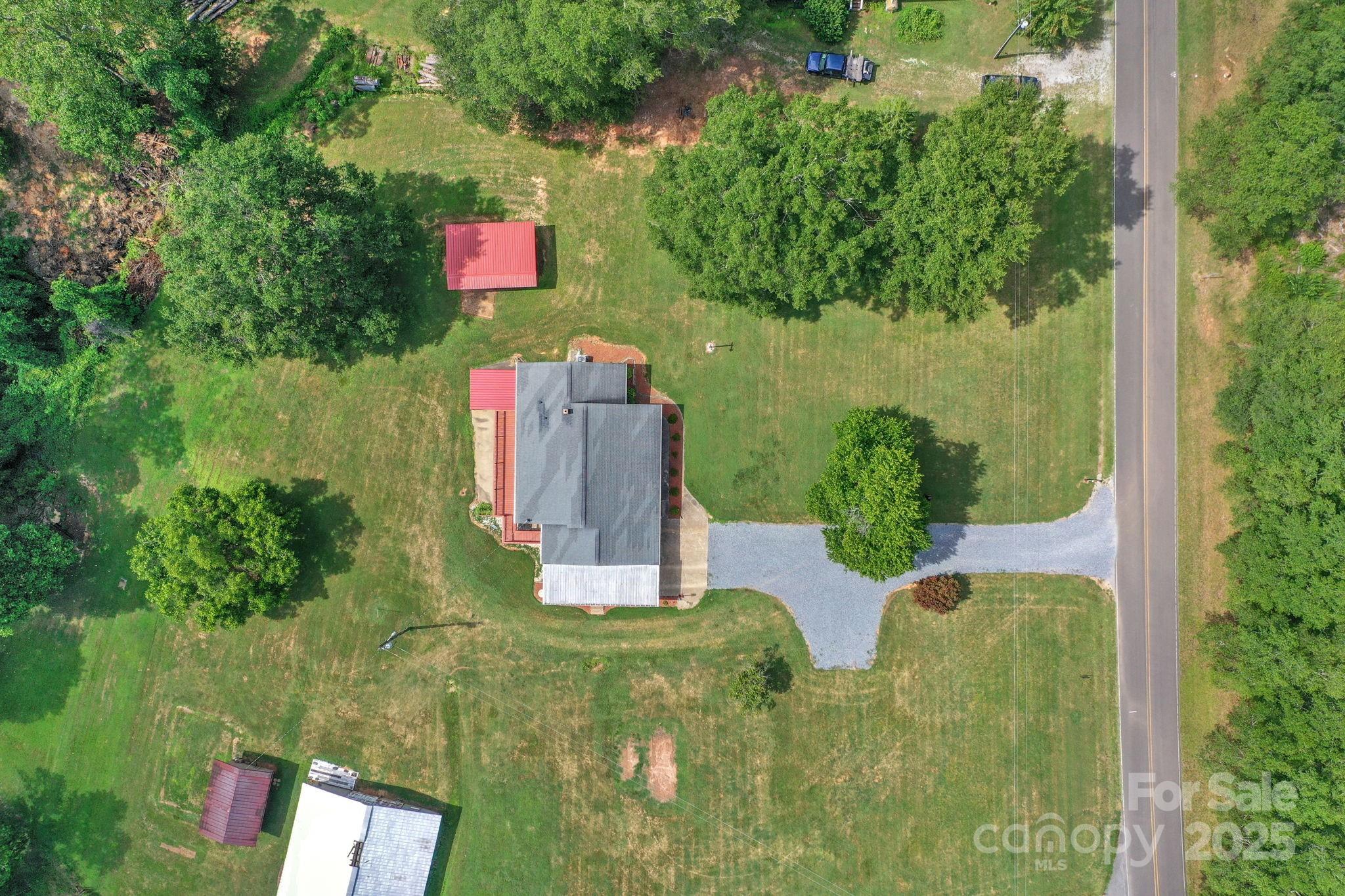 2036 Biggers Lake Road Shelby, NC 28152 - Photo 42 of 45 an aerial view of residential house with outdoor space and trees all around