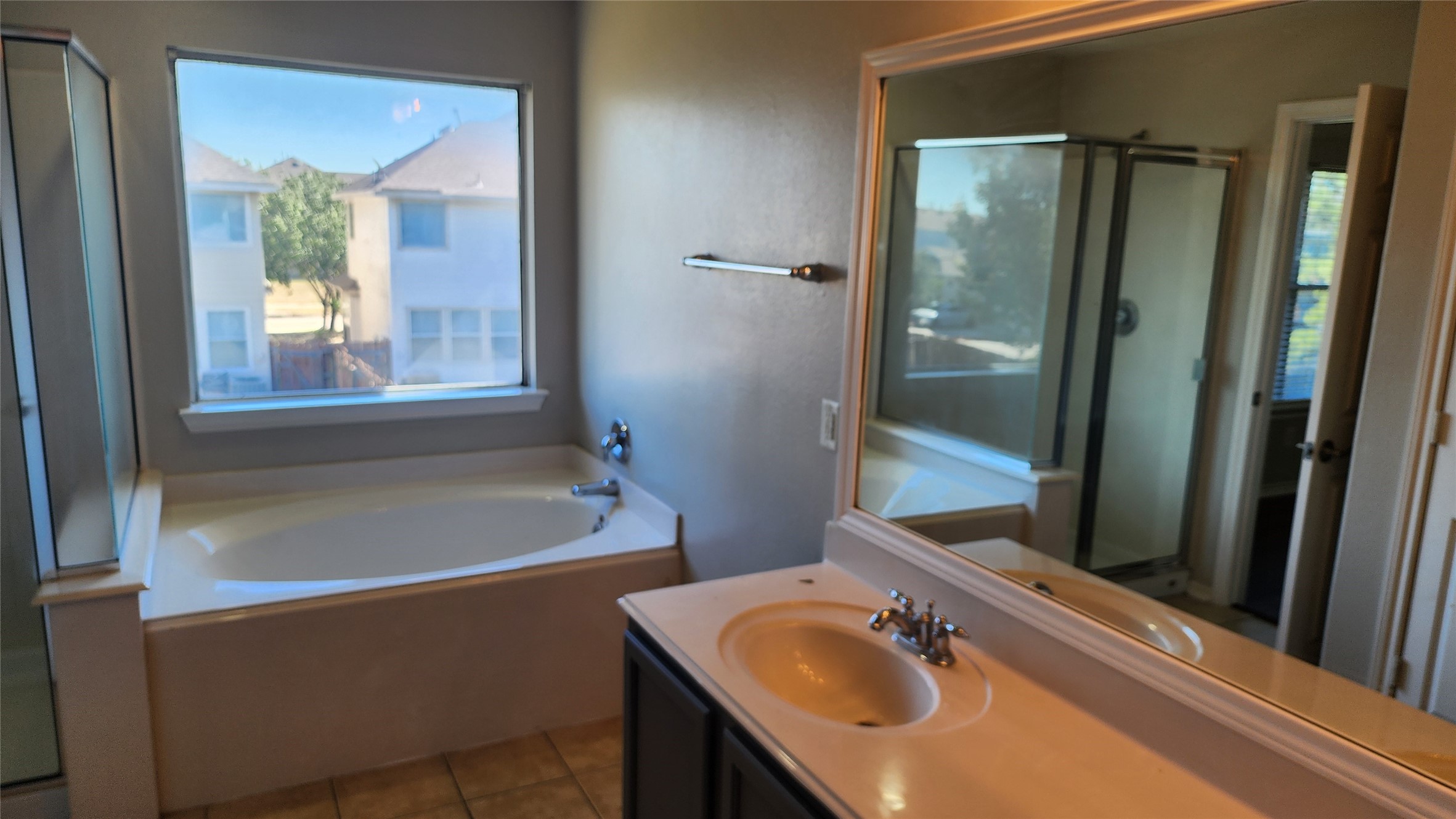 11428 Hackmatack Way Houston, TX 77066 - Photo 12 of 49 a bathroom with a granite countertop sink and a mirror