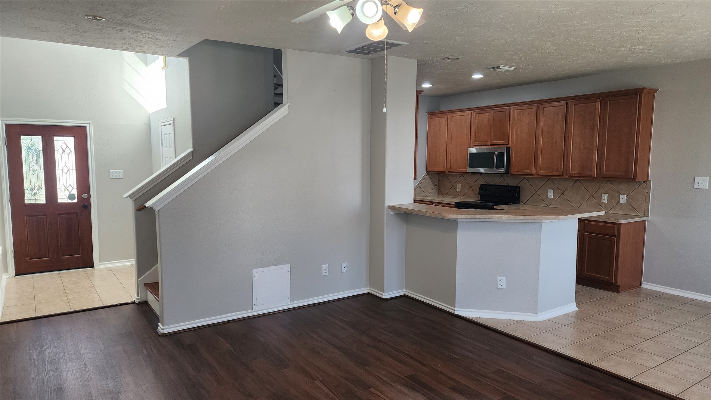 11428 Hackmatack Way Houston, TX 77066 - Photo 44 of 49 a kitchen with a refrigerator and a stove top oven