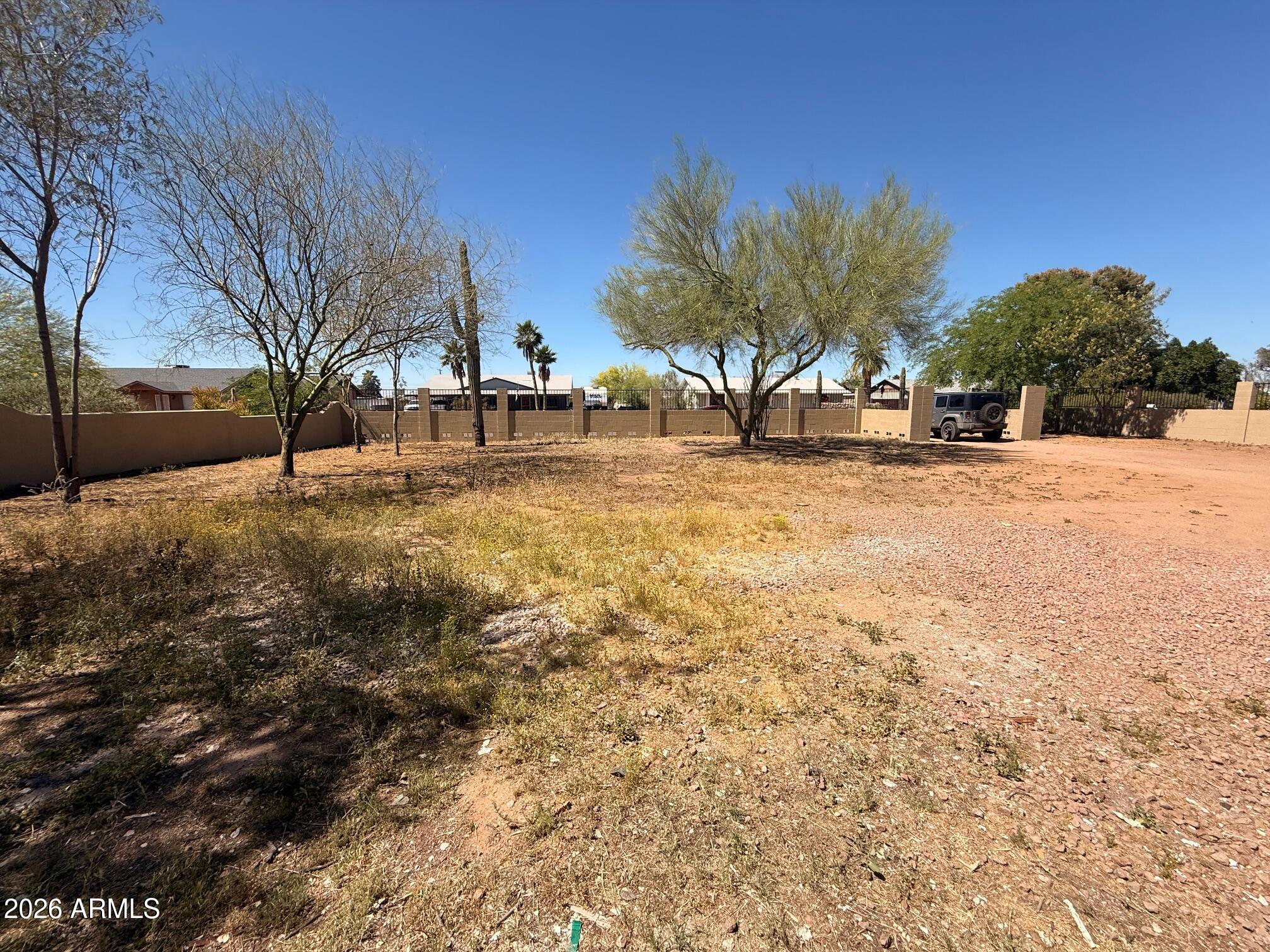 135 Rex Avenue Apache Junction, AZ 85120 - Photo 13 of 27 a view of road and trees