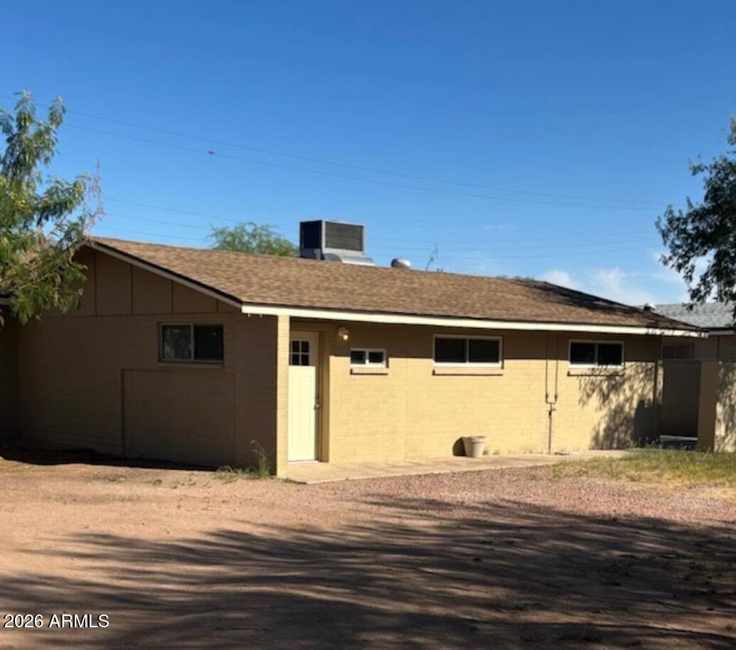 135 Rex Avenue Apache Junction, AZ 85120 - Photo 2 of 27 a front view of a house with a yard