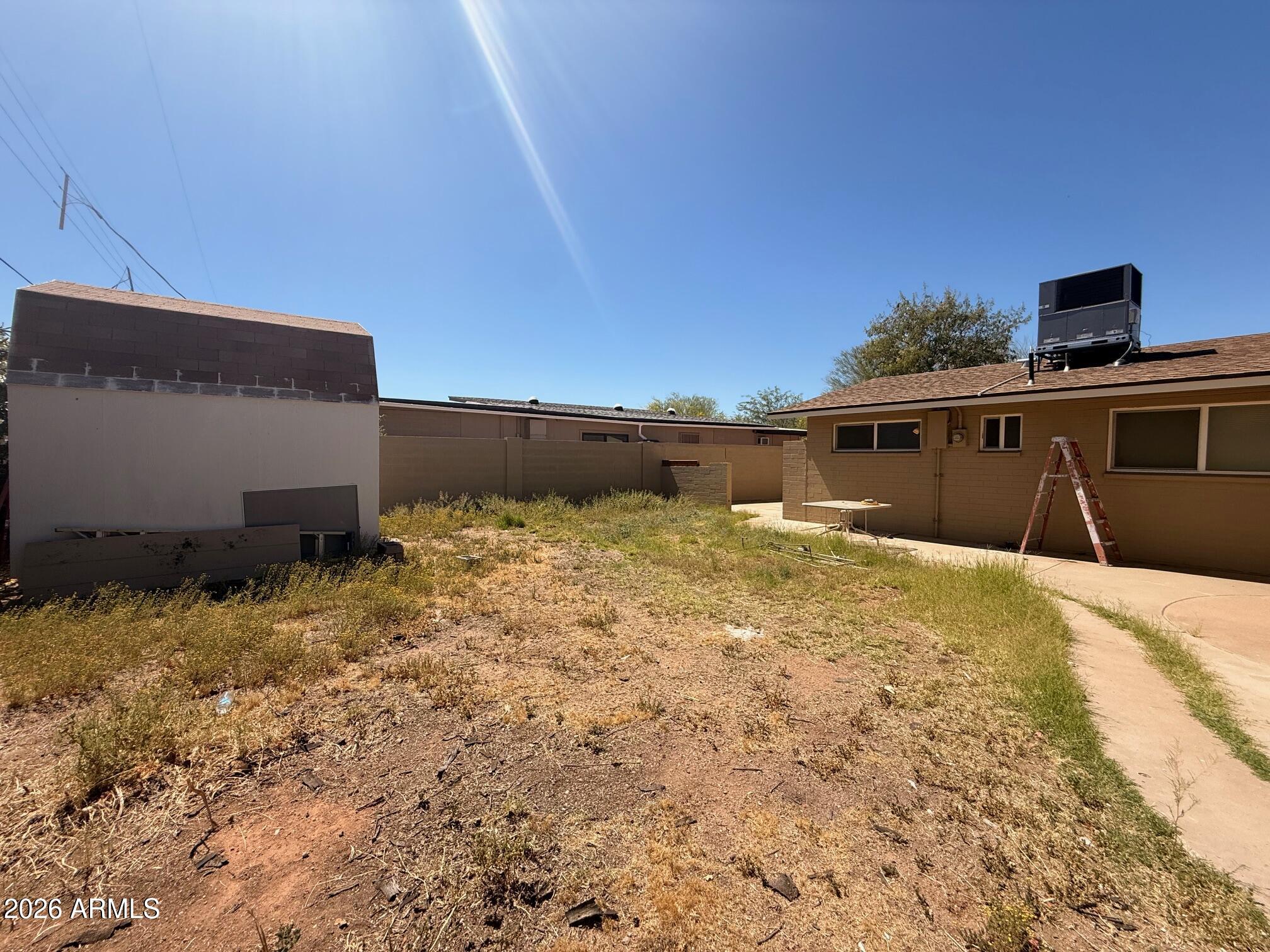 135 Rex Avenue Apache Junction, AZ 85120 - Photo 27 of 27 a view of a house with a yard