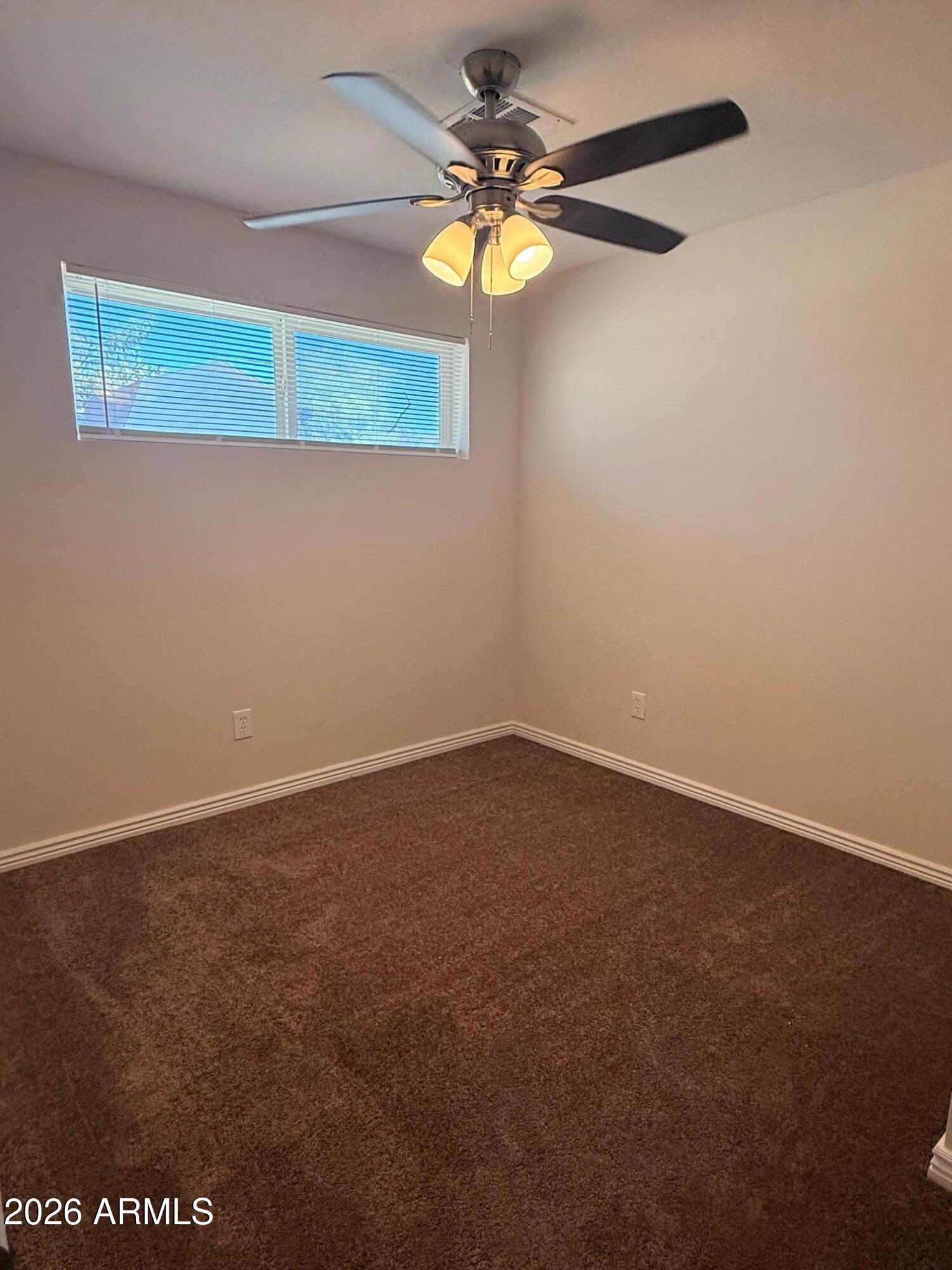 135 Rex Avenue Apache Junction, AZ 85120 - Photo 10 of 27 a view of a small space with a fan