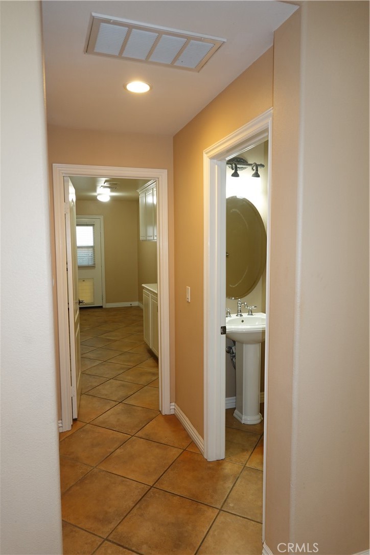 1840 West Deerfield Road Santa Ana, CA 92704 - Photo 9 of 24 hallway to laundry room