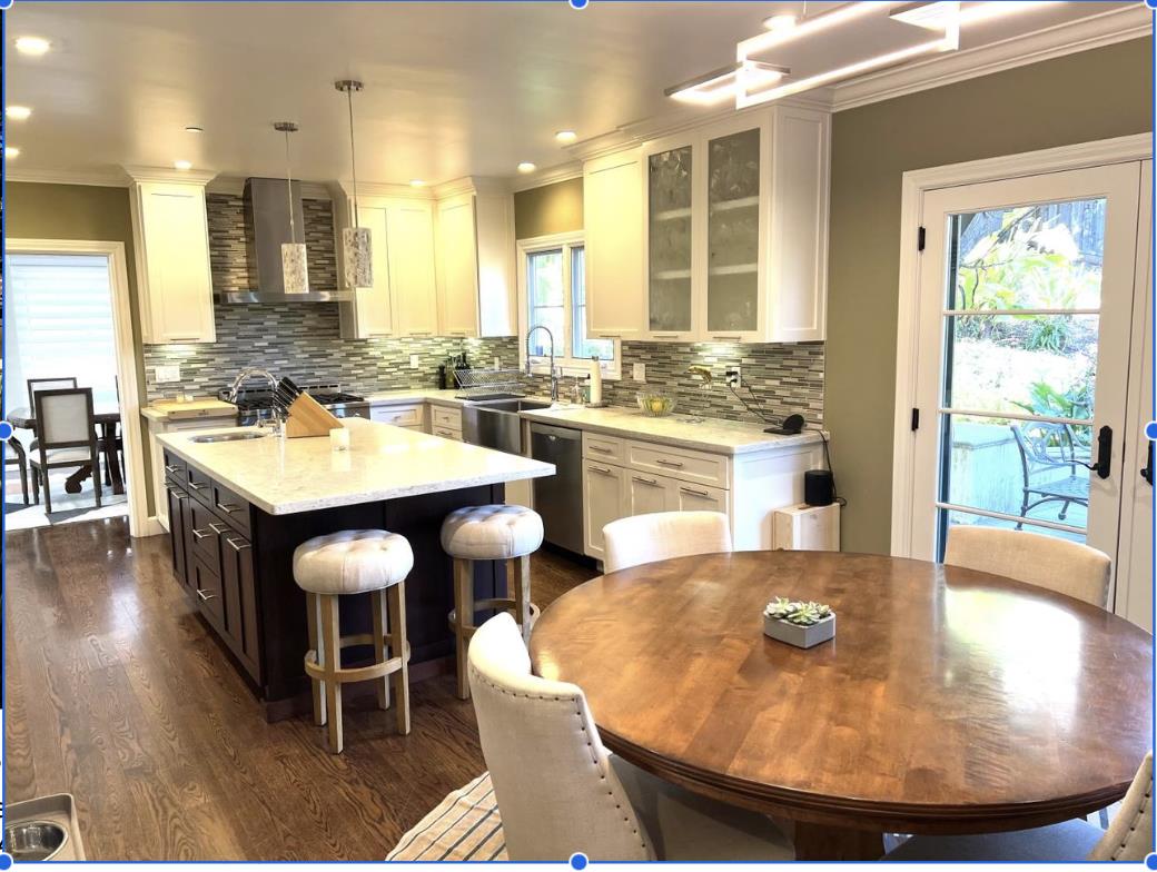1120 Southdown Road Hillsborough, CA 94010 - Photo 5 of 12 a large kitchen with a table and chairs