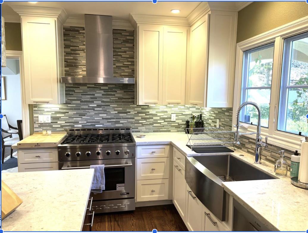 1120 Southdown Road Hillsborough, CA 94010 - Photo 7 of 12 a kitchen with a sink stove top oven and cabinets
