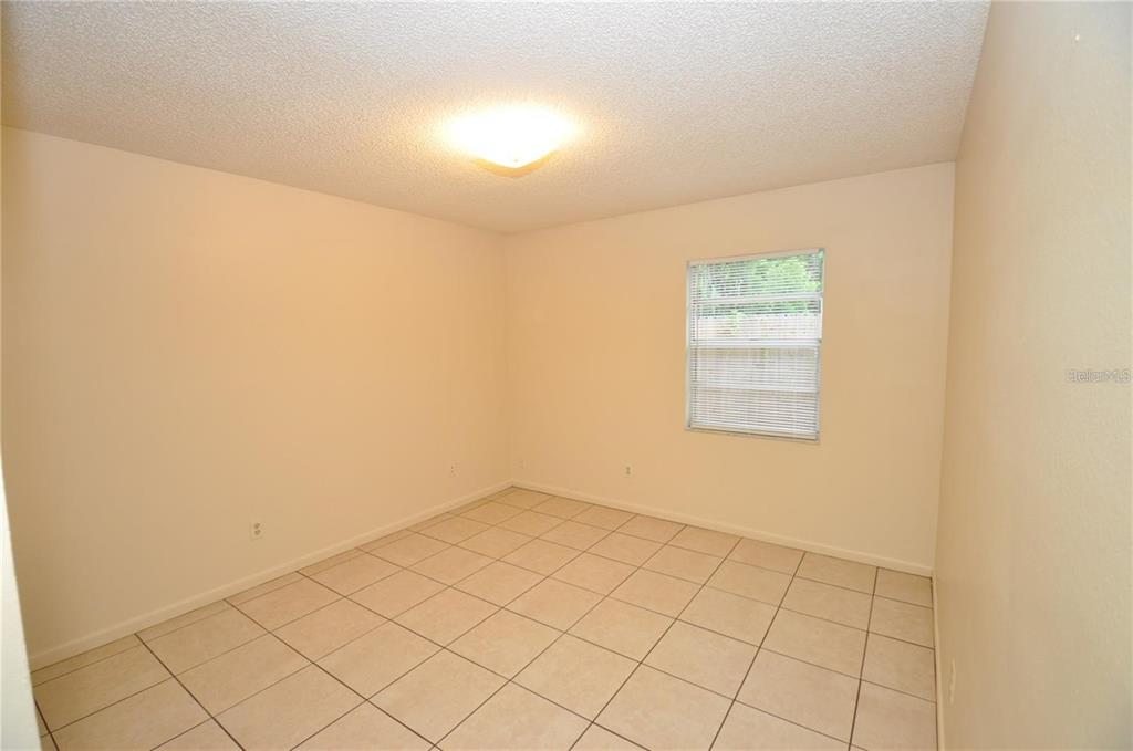 1434 East Fern Road, Unit 1434 Lakeland, FL 33801 - Photo 12 of 13 an empty room with windows
