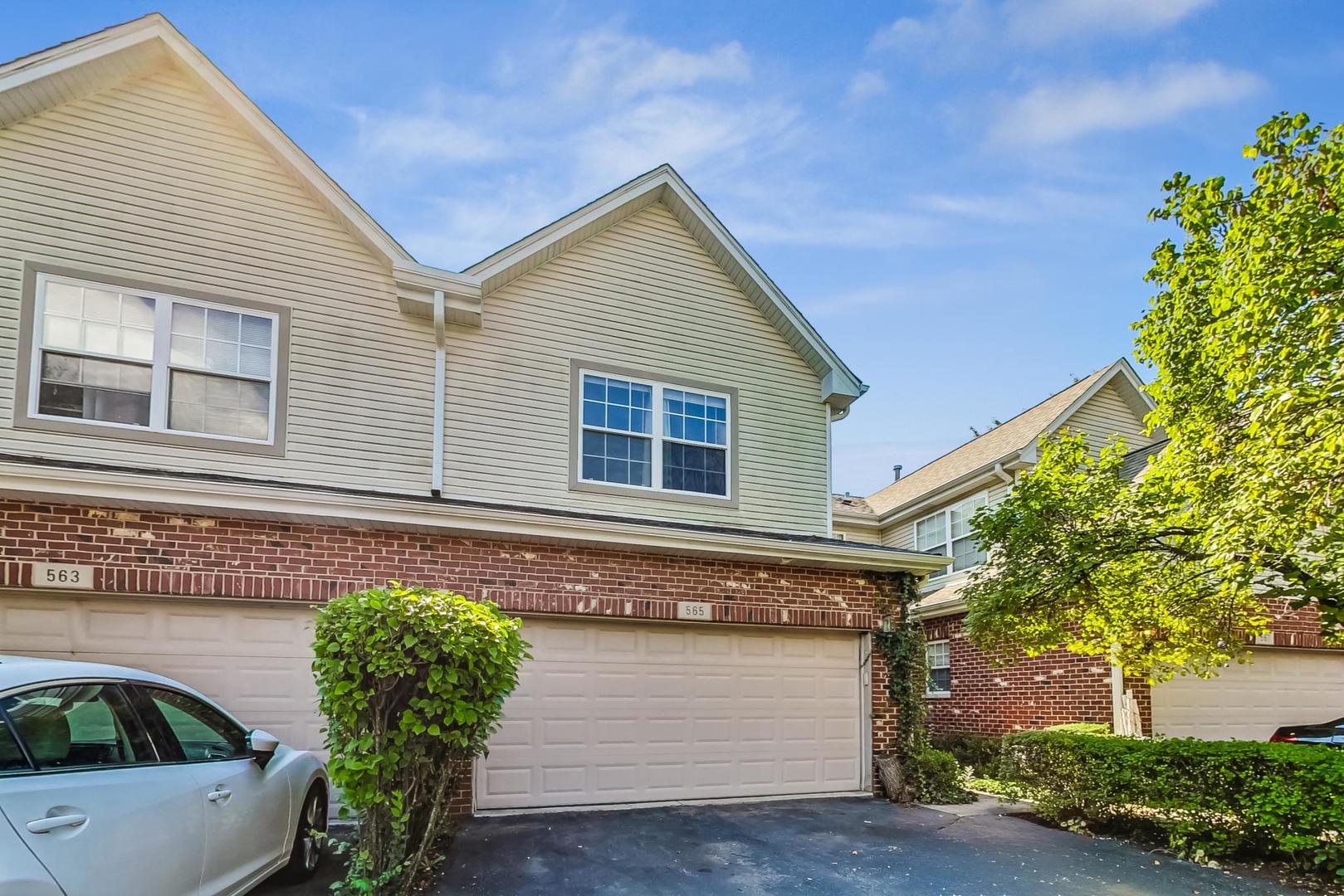 565 Goodwin Drive Bolingbrook, IL 60440 - Photo 1 of 44 a front view of a house with garden