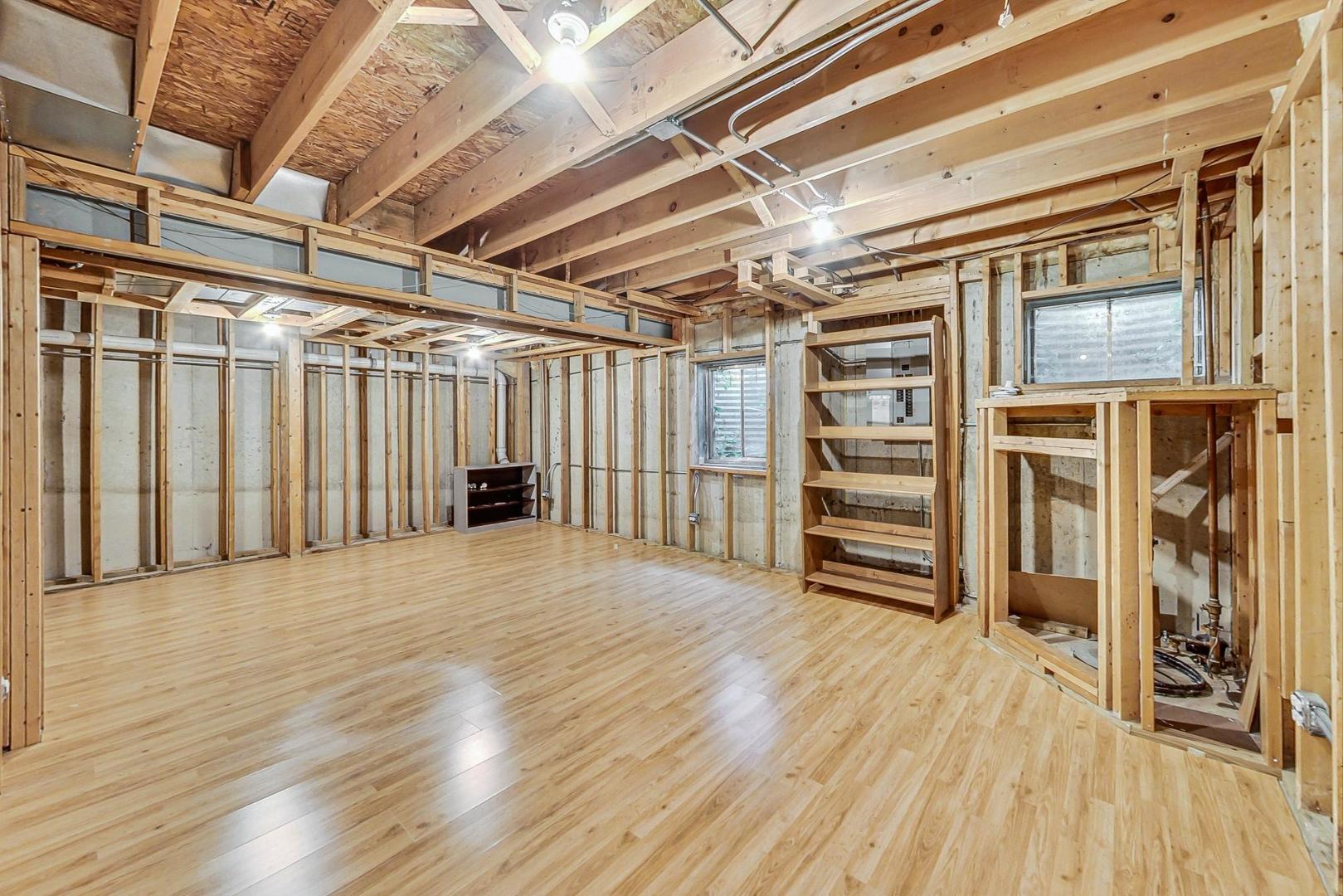 565 Goodwin Drive Bolingbrook, IL 60440 - Photo 31 of 44 a view of an empty room with wooden floor and a window