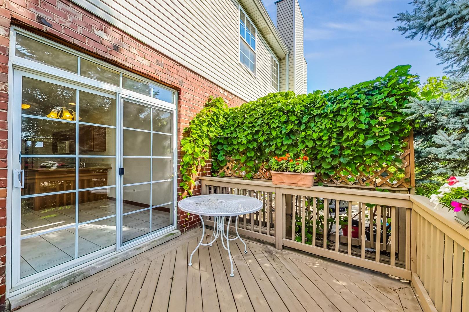 565 Goodwin Drive Bolingbrook, IL 60440 - Photo 36 of 44 a view of a deck with wooden floor and seating space