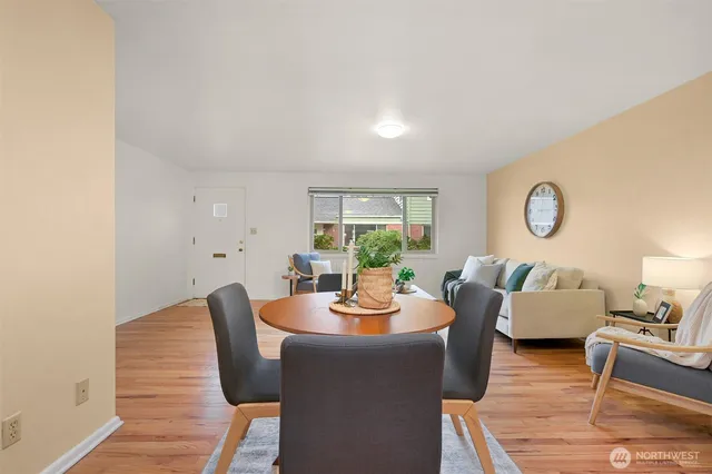 a dining room with furniture and window
