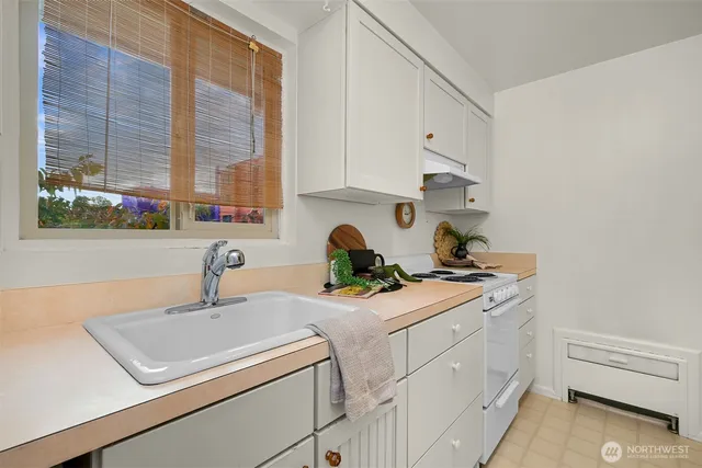 a bathroom with a sink a mirror and shower
