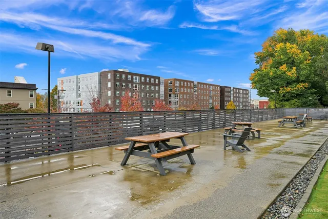 a swimming pool with outdoor seating and yard