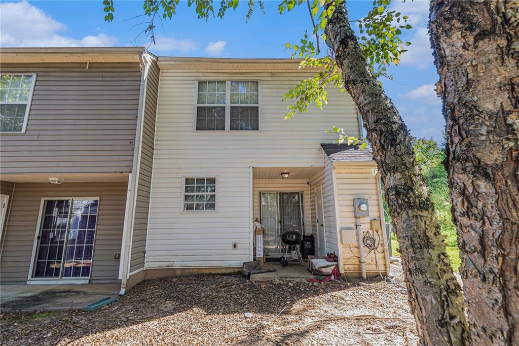 6536 Arbor Gate Drive Southwest, Unit 2 Mableton, GA 30126 - Photo 25 of 27 a view of a house with backyard and trees